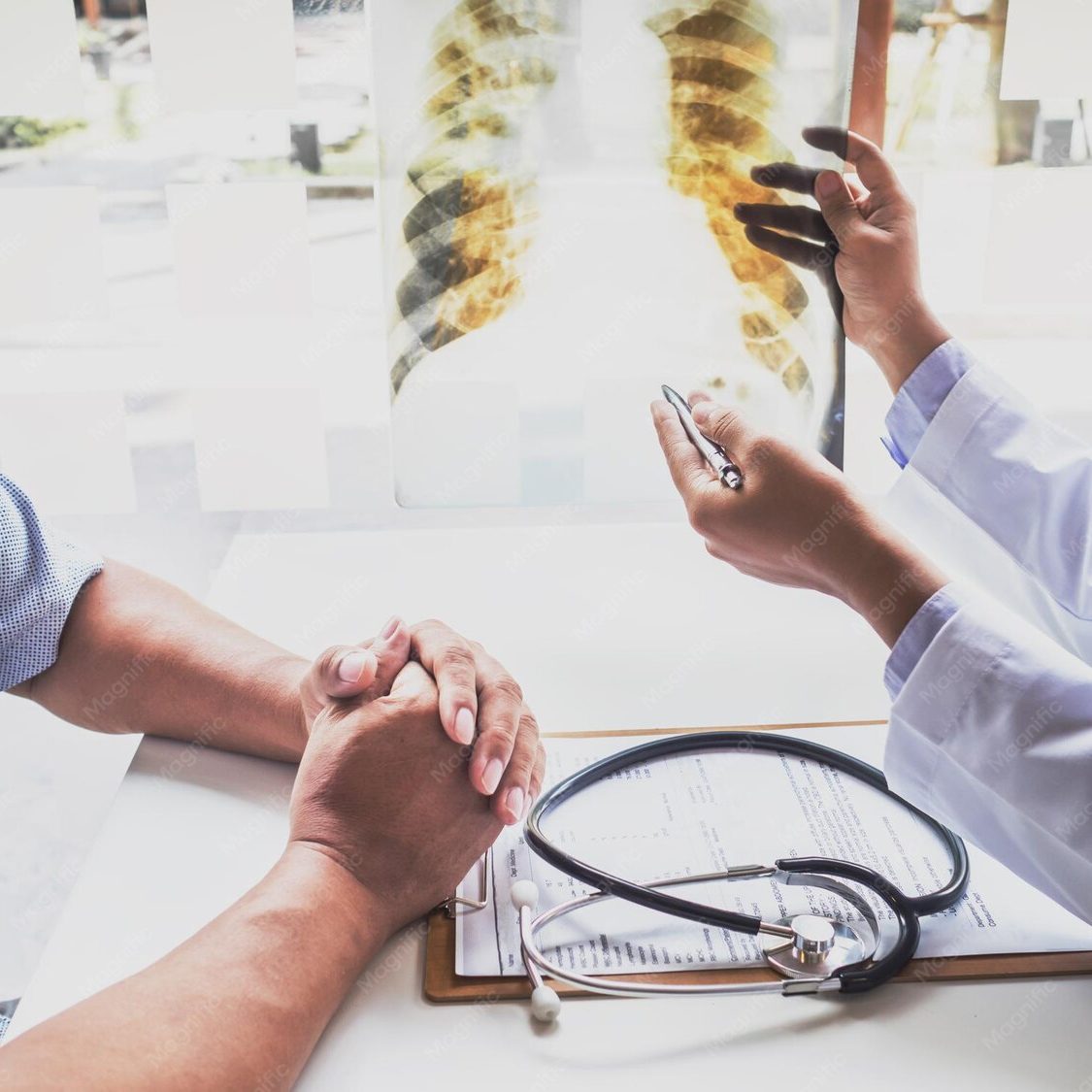 doctor-explaining-x-ray-patient-hospital_177530-4112